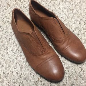 Brown leather flats